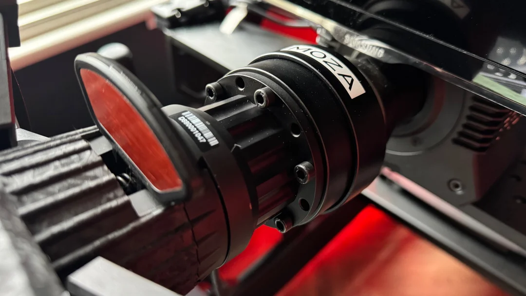 Asetek third party QR Adapter mounted to a racing wheel